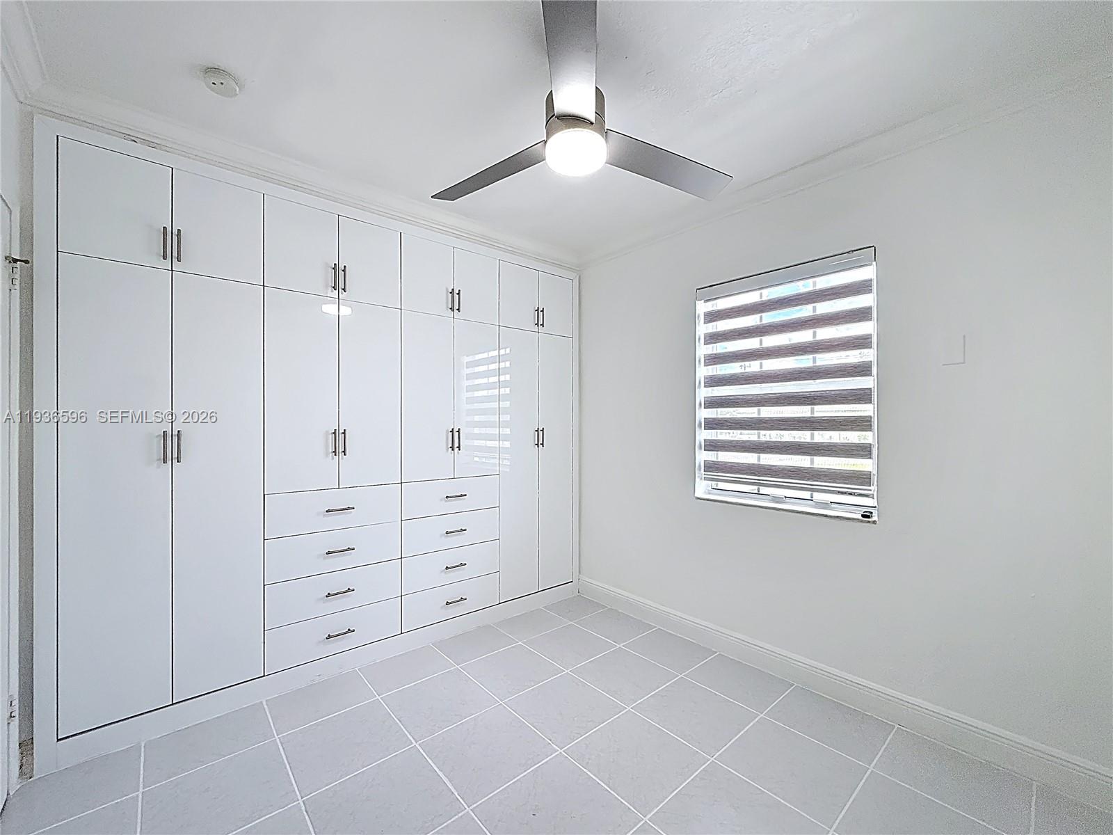 7410 Southwest 39th Street Miami, FL 33155 - Photo 20 of 47 a view of an empty room with a window