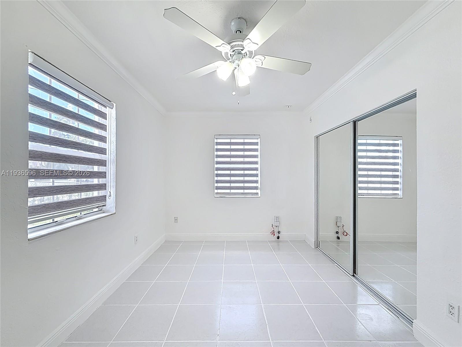 7410 Southwest 39th Street Miami, FL 33155 - Photo 22 of 47 a view of an empty room with a window