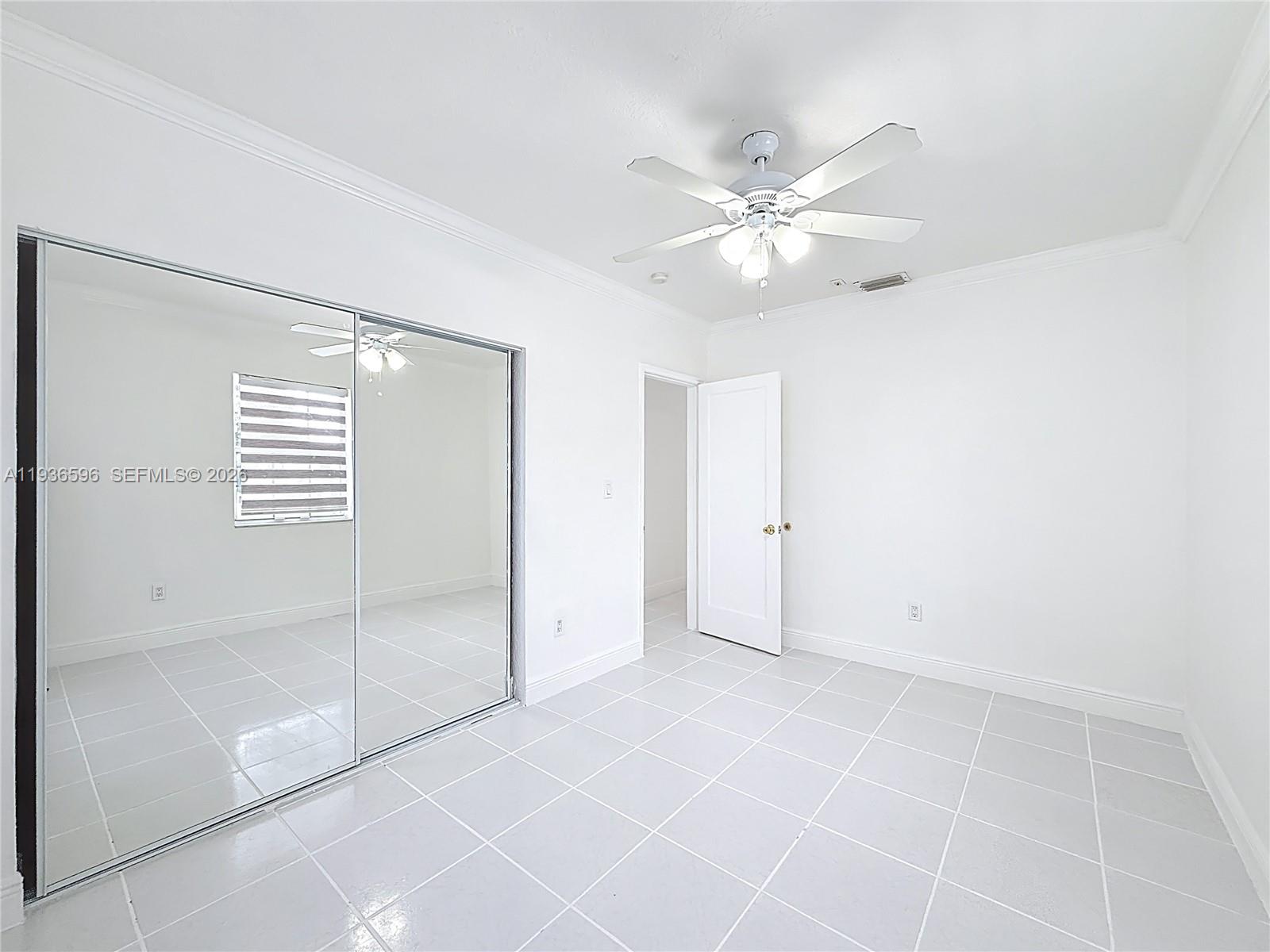 7410 Southwest 39th Street Miami, FL 33155 - Photo 24 of 47 a view of an empty room with a window