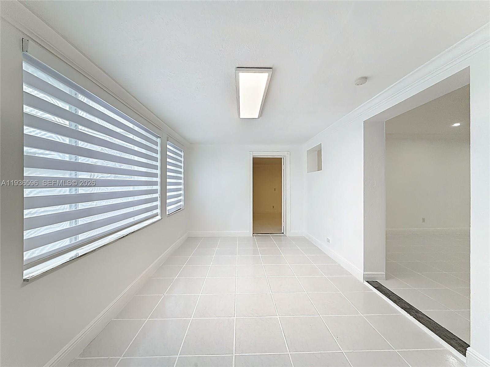 7410 Southwest 39th Street Miami, FL 33155 - Photo 30 of 47 a view of an empty room with a window