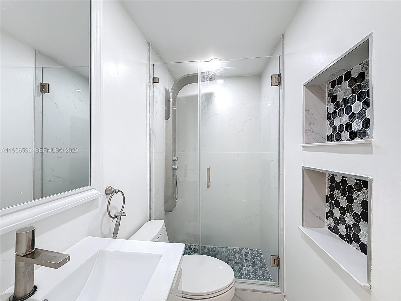 7410 Southwest 39th Street Miami, FL 33155 - Photo 35 of 47 a bathroom with a toilet sink and shower