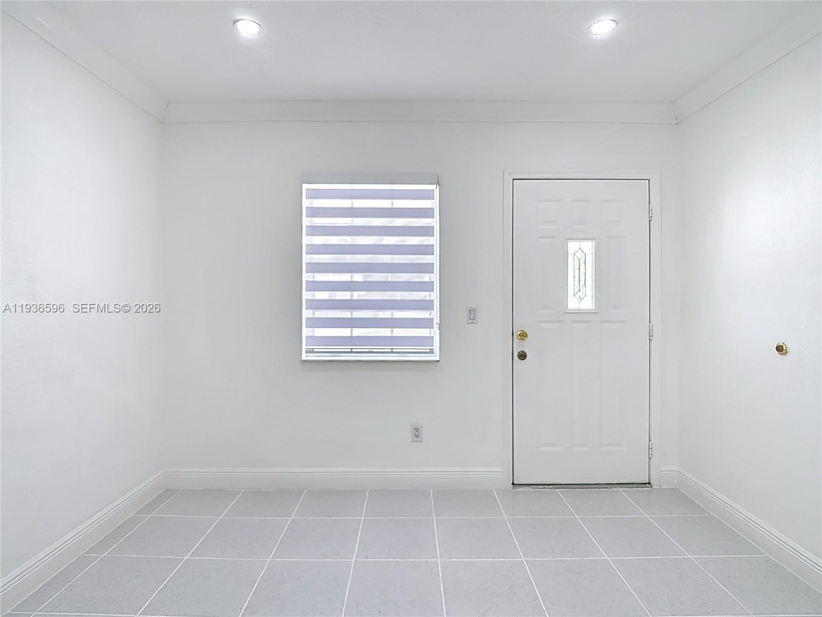 7410 Southwest 39th Street Miami, FL 33155 - Photo 9 of 47 a view of an empty room with a window