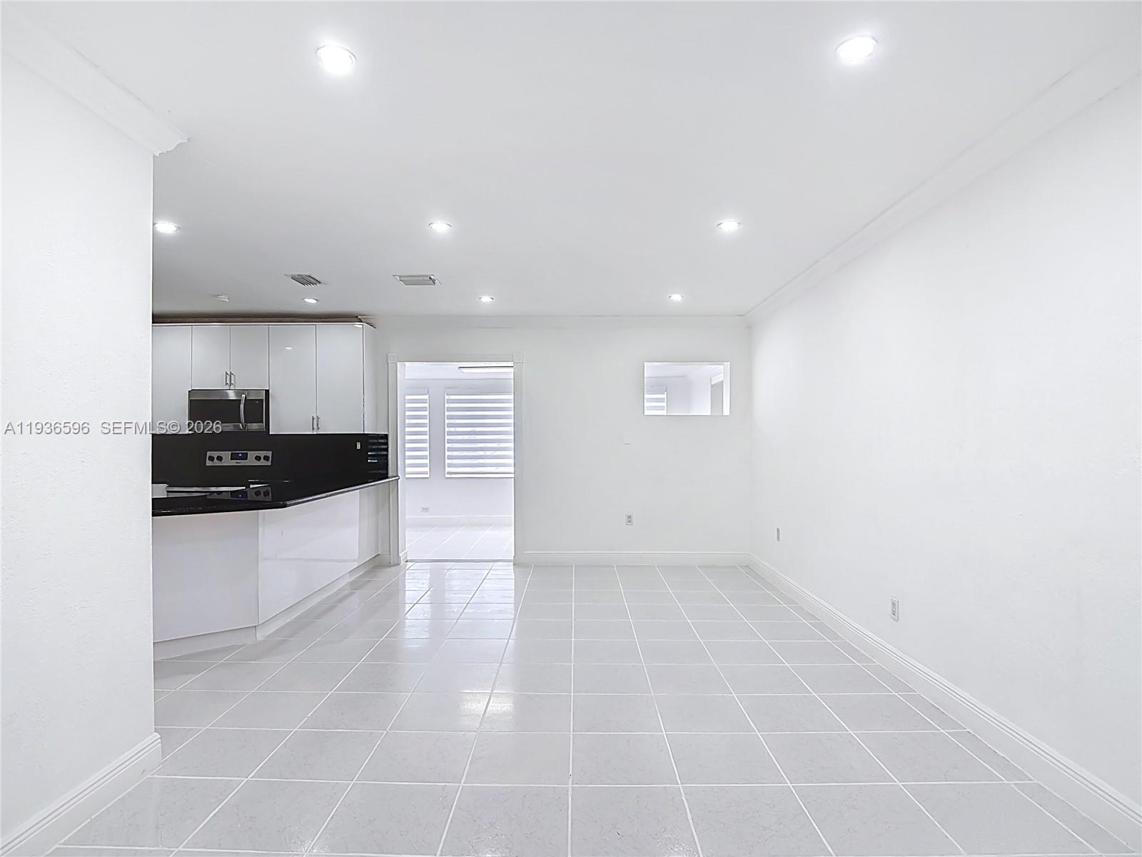 7410 Southwest 39th Street Miami, FL 33155 - Photo 10 of 47 a kitchen with a sink and cabinets