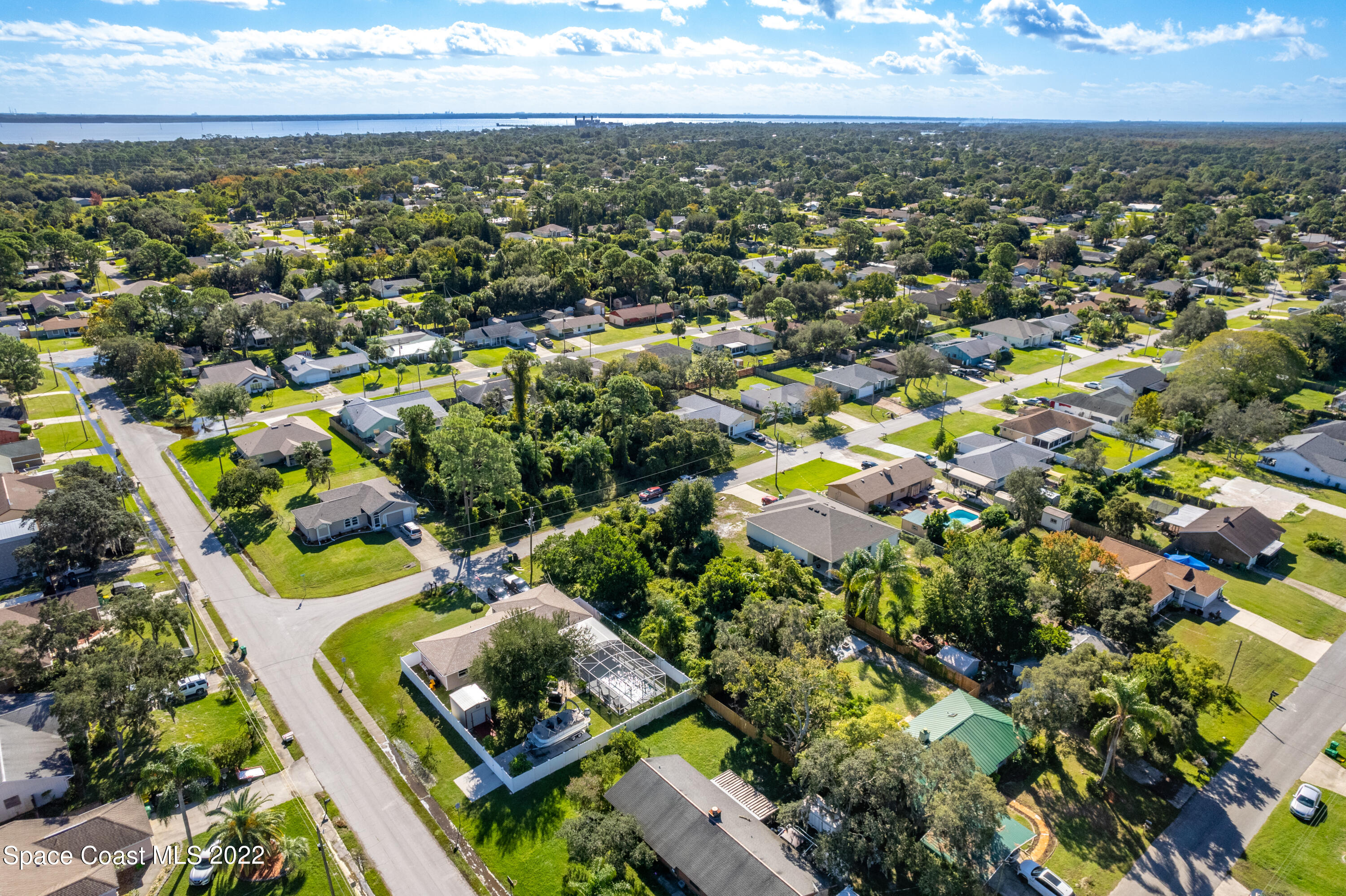7412 Glenwood Road Cocoa, FL 32927 - Photo 4 of 6 an aerial view of residential houses with outdoor space