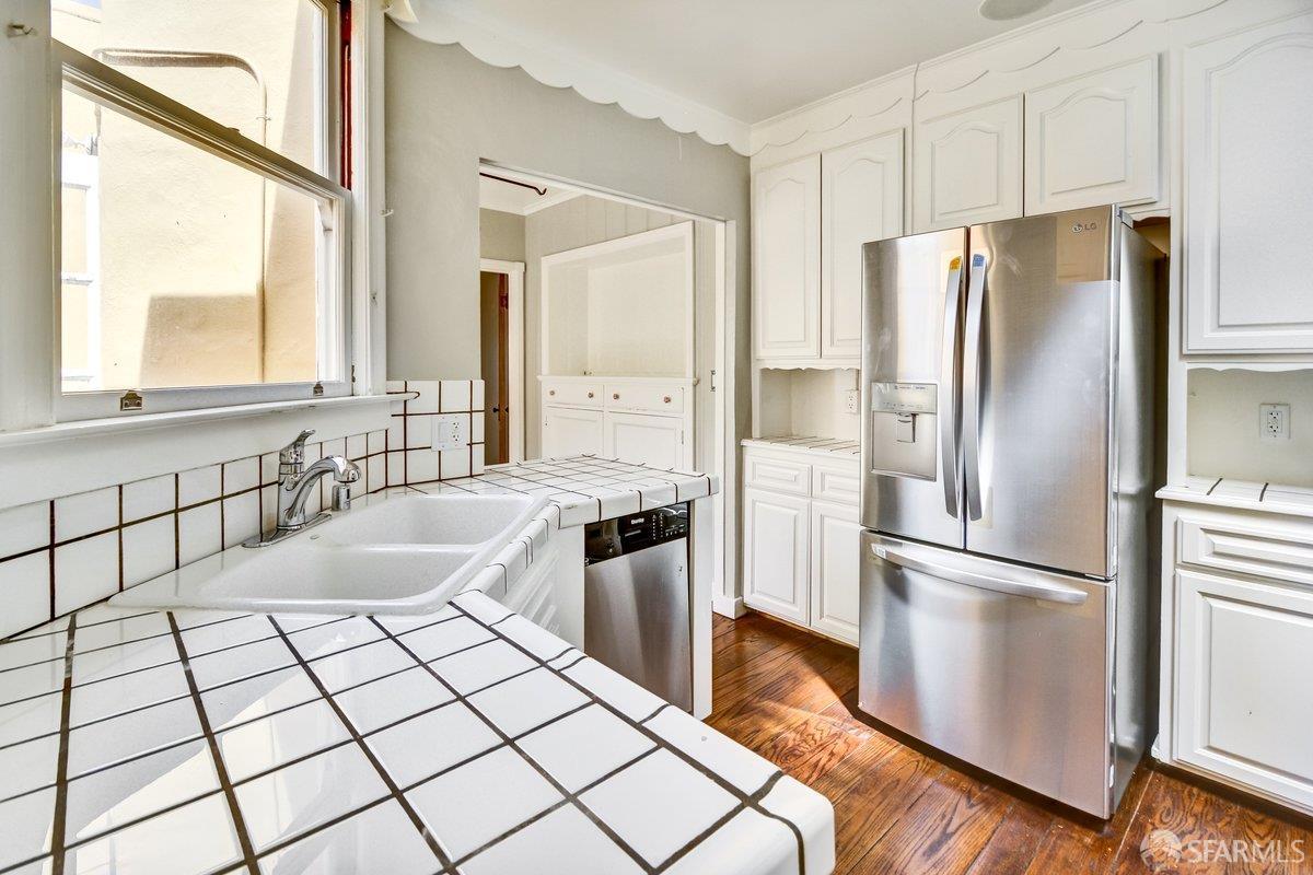 1770 17th Avenue San Francisco, CA 94122 - Photo 11 of 31 a kitchen with granite countertop a refrigerator and a sink