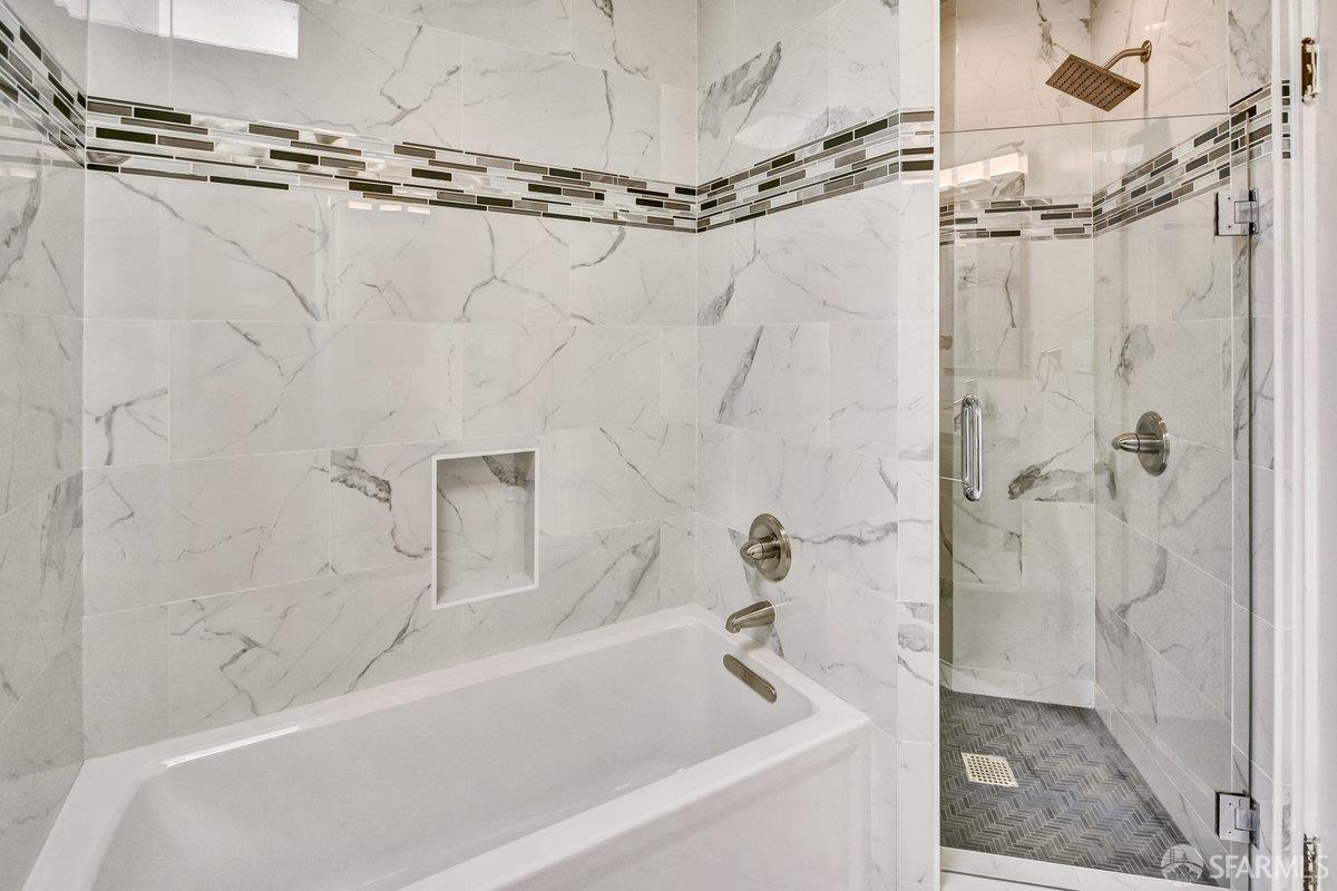 1770 17th Avenue San Francisco, CA 94122 - Photo 17 of 31 a bathroom with a shower and a bath tub