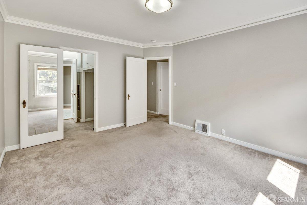 1770 17th Avenue San Francisco, CA 94122 - Photo 28 of 31 an empty room with closet and windows