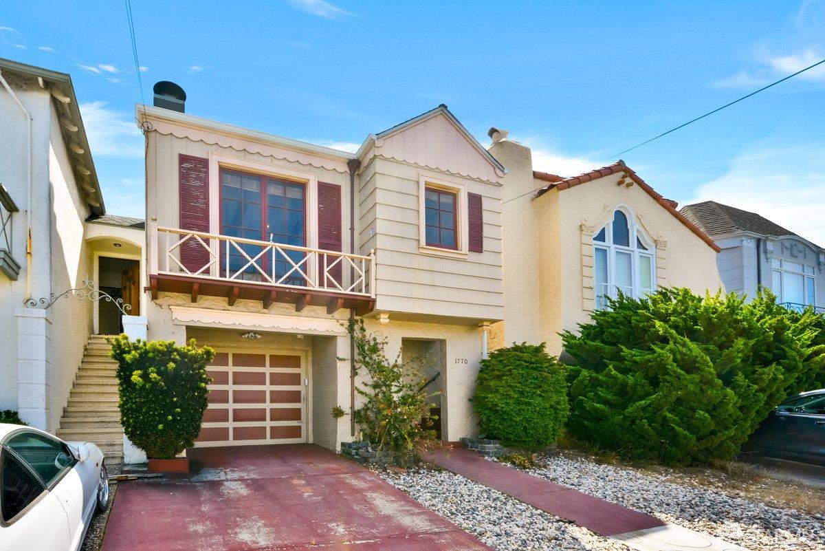 1770 17th Avenue San Francisco, CA 94122 - Photo 31 of 31 a view of a white house next to a yard