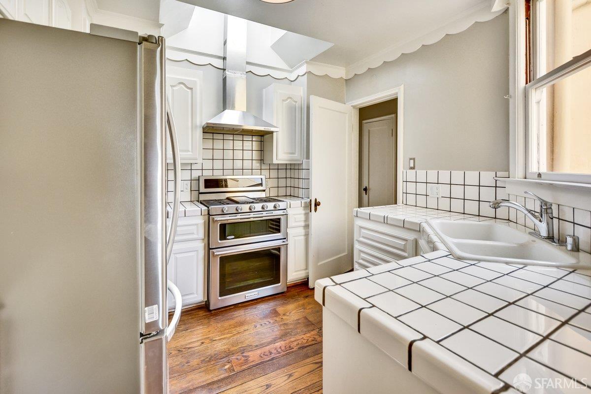 1770 17th Avenue San Francisco, CA 94122 - Photo 10 of 31 a bedroom with a bed and a sink