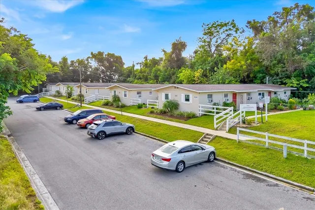 an outdoor space with furniture and garden