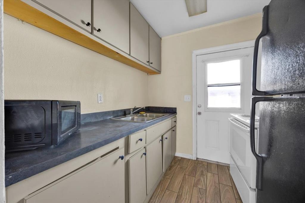 757-797 Roane Road Clermont, FL 34711 - Photo 11 of 17 a kitchen with a refrigerator and a sink