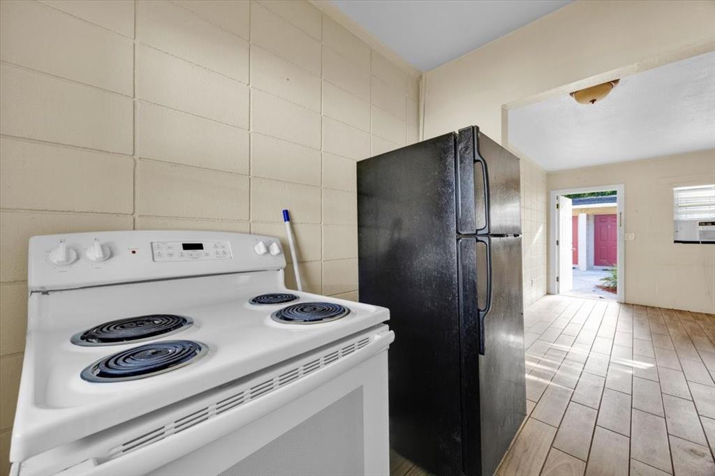 757-797 Roane Road Clermont, FL 34711 - Photo 12 of 17 a kitchen with a refrigerator and a stove