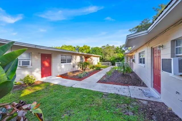 a front view of house with yard and outdoor seating
