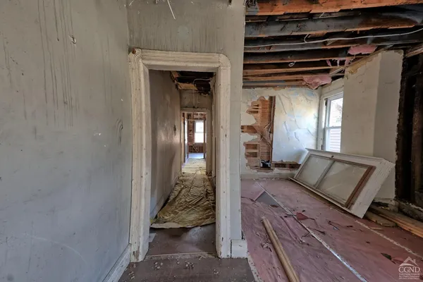 a view of living room and wooden floor