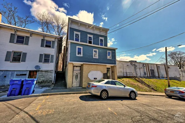 a view of street with parked cars