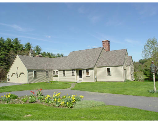 191 Wilder Road Bolton, MA 01740 - Photo 1 of 8 a front view of a house with a garden