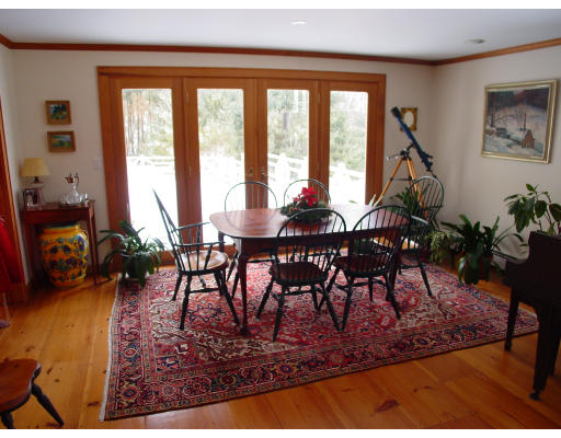 191 Wilder Road Bolton, MA 01740 - Photo 2 of 8 a view of a dining room with furniture window and outside view