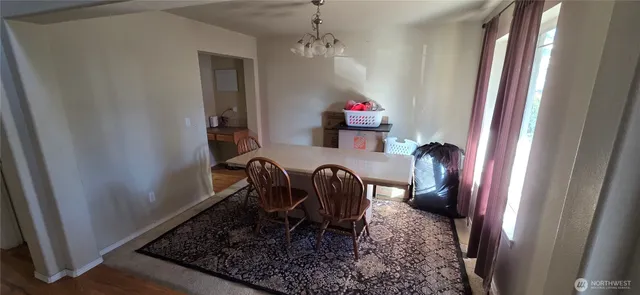 a view of a hallway with seating area