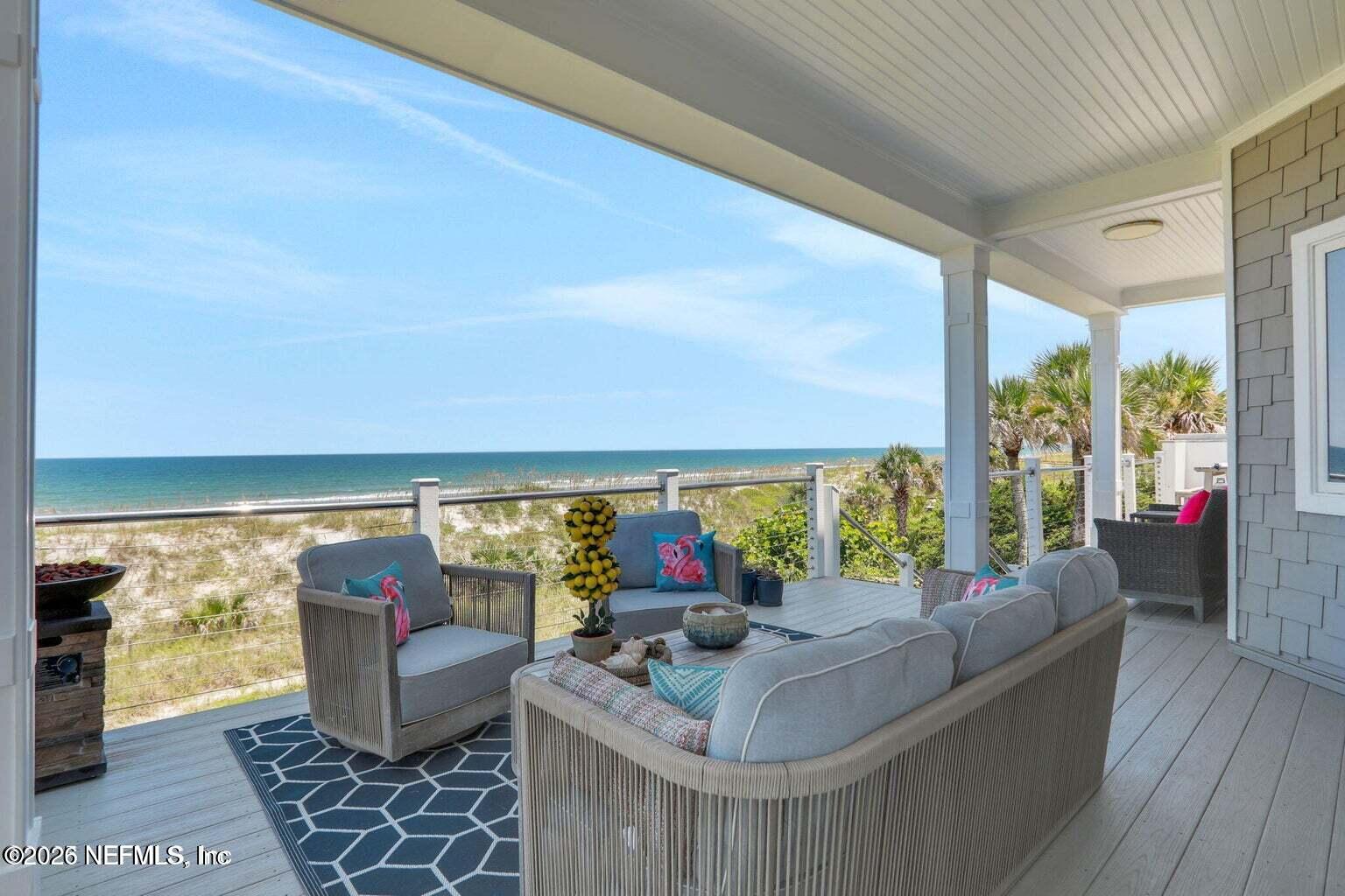 1403 Ocean Front Neptune Beach, FL 32266 - Photo 21 of 37 a living room with furniture and a large window