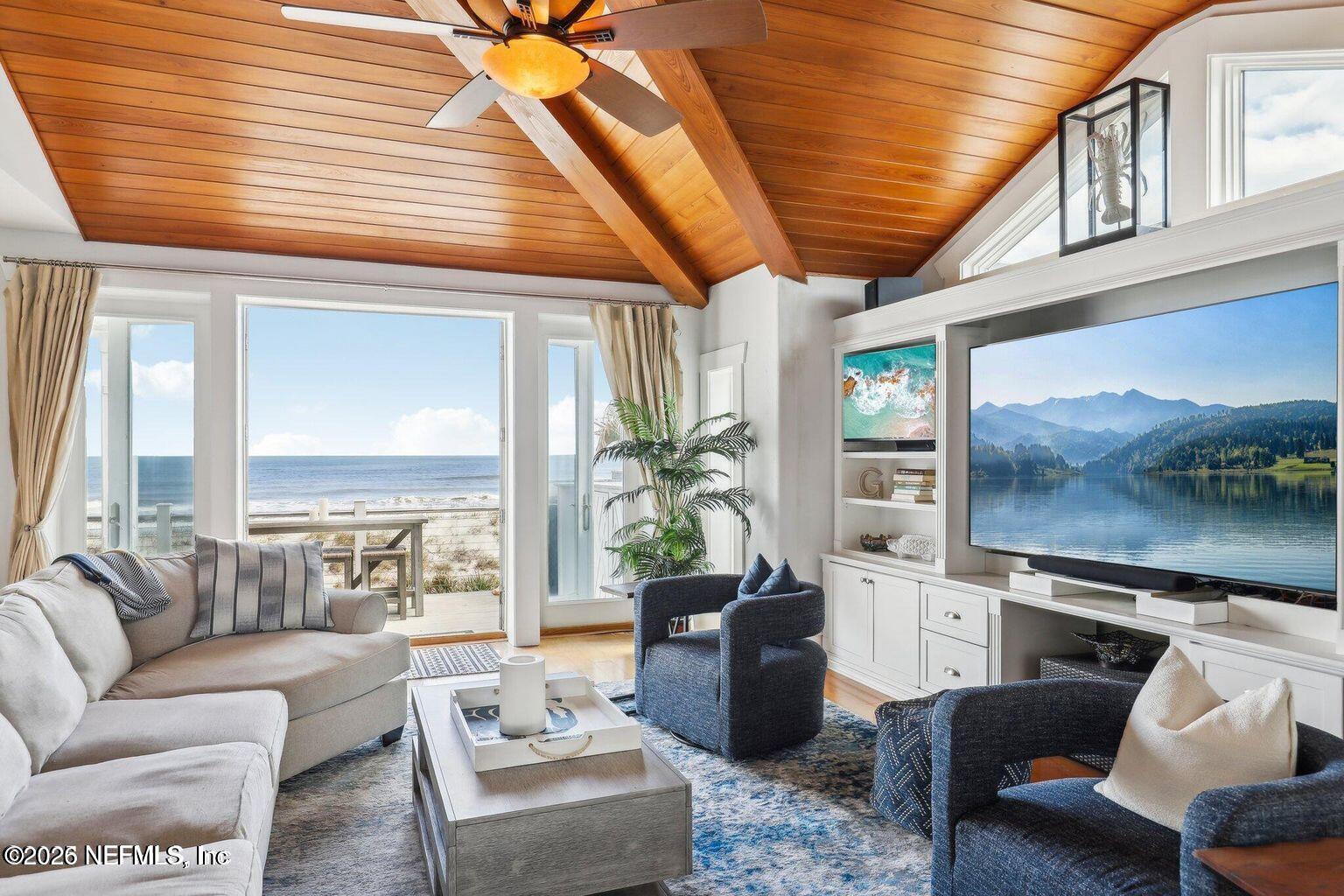 1403 Ocean Front Neptune Beach, FL 32266 - Photo 7 of 37 a living room with furniture and floor to ceiling windows