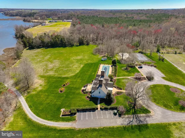 a view of a swimming pool with a yard