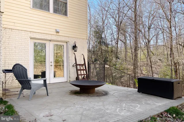 a view of a patio with chair and tables