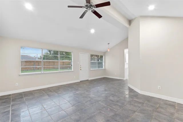 a view of an empty room with a window