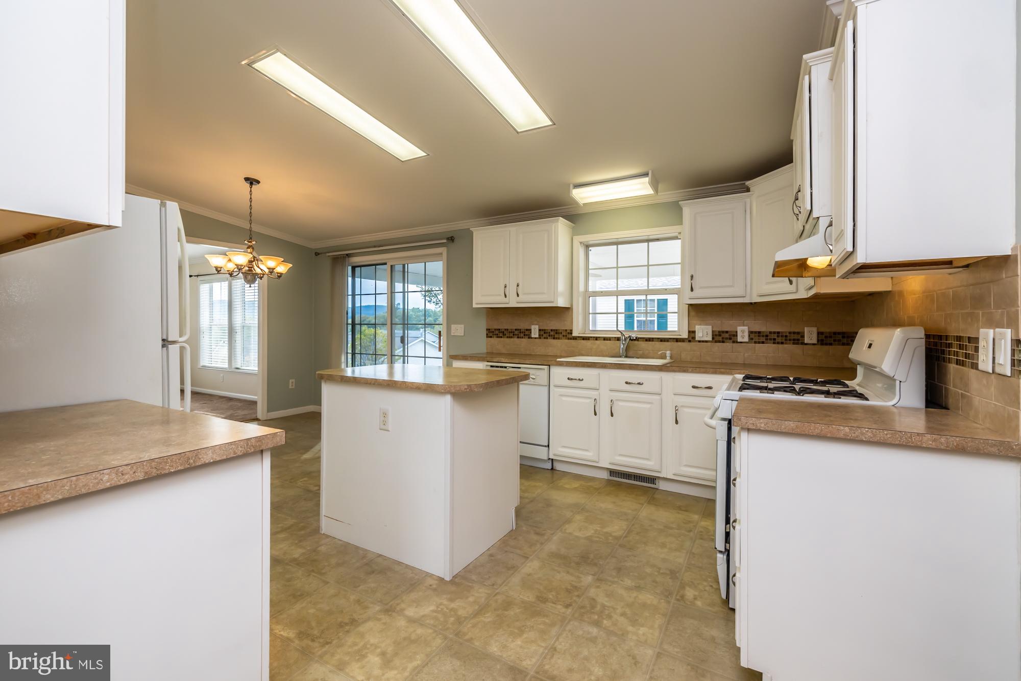 81 Westin Road Douglassville, PA 19518 - Photo 16 of 45 a kitchen with granite countertop white cabinets and white appliances