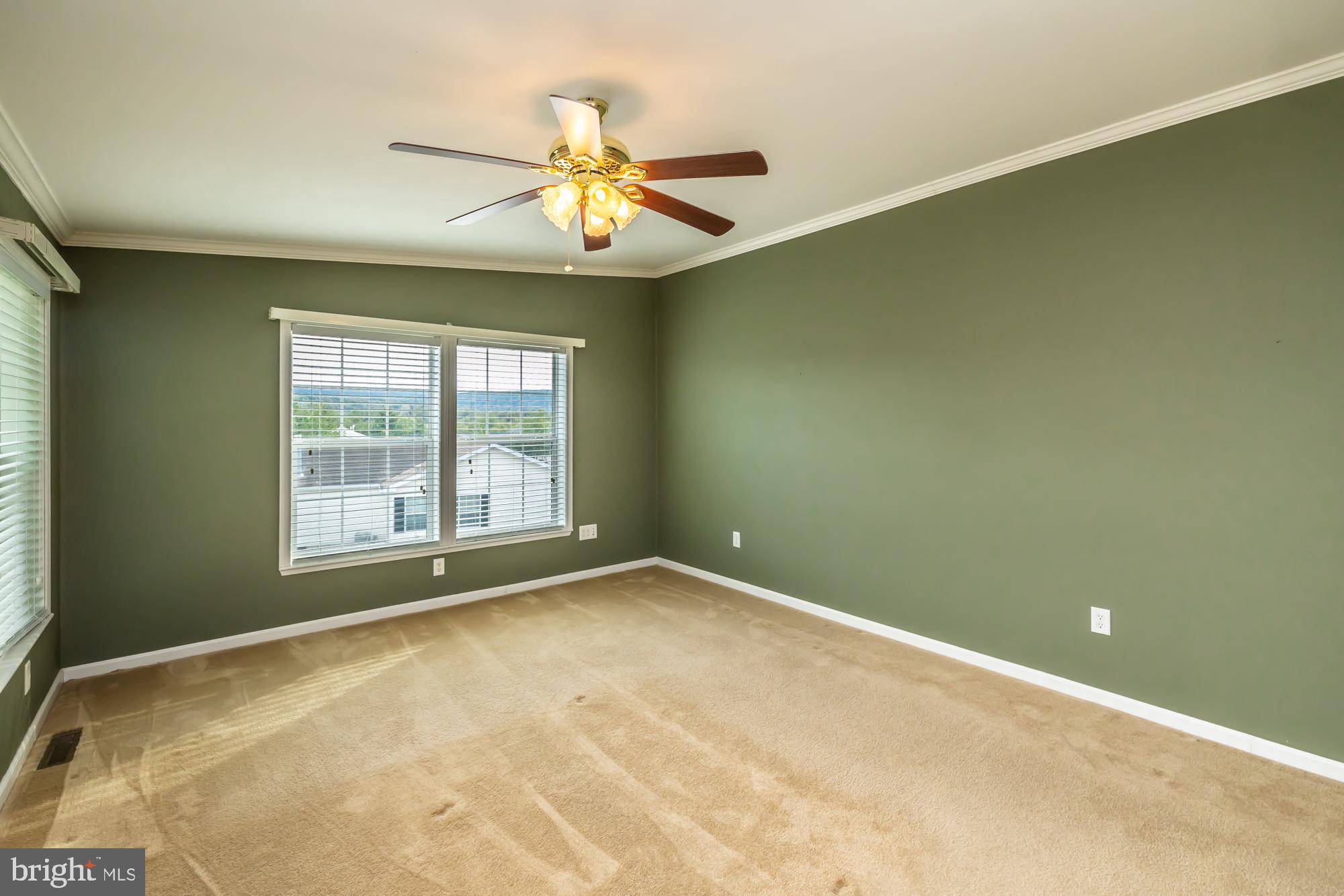 81 Westin Road Douglassville, PA 19518 - Photo 27 of 45 a view of an empty room with chandelier fan and a window