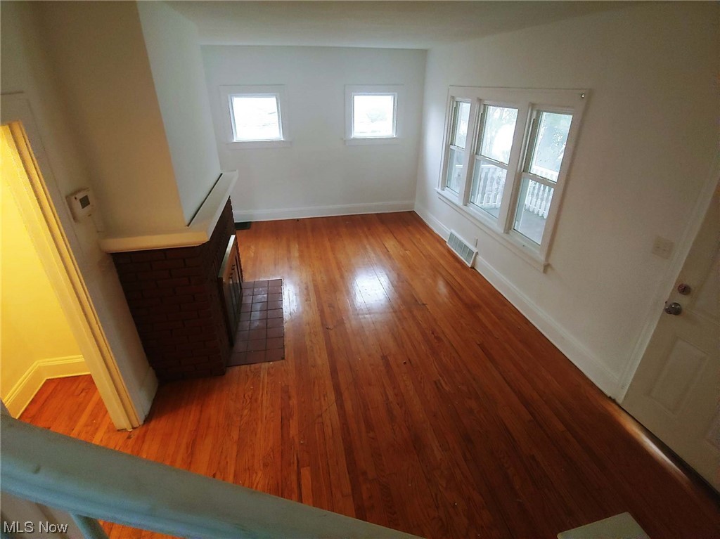 1464 Sherbrook Road Cleveland, OH 44121 - Photo 5 of 15 Unfurnished living room featuring dark wood-type flooring
