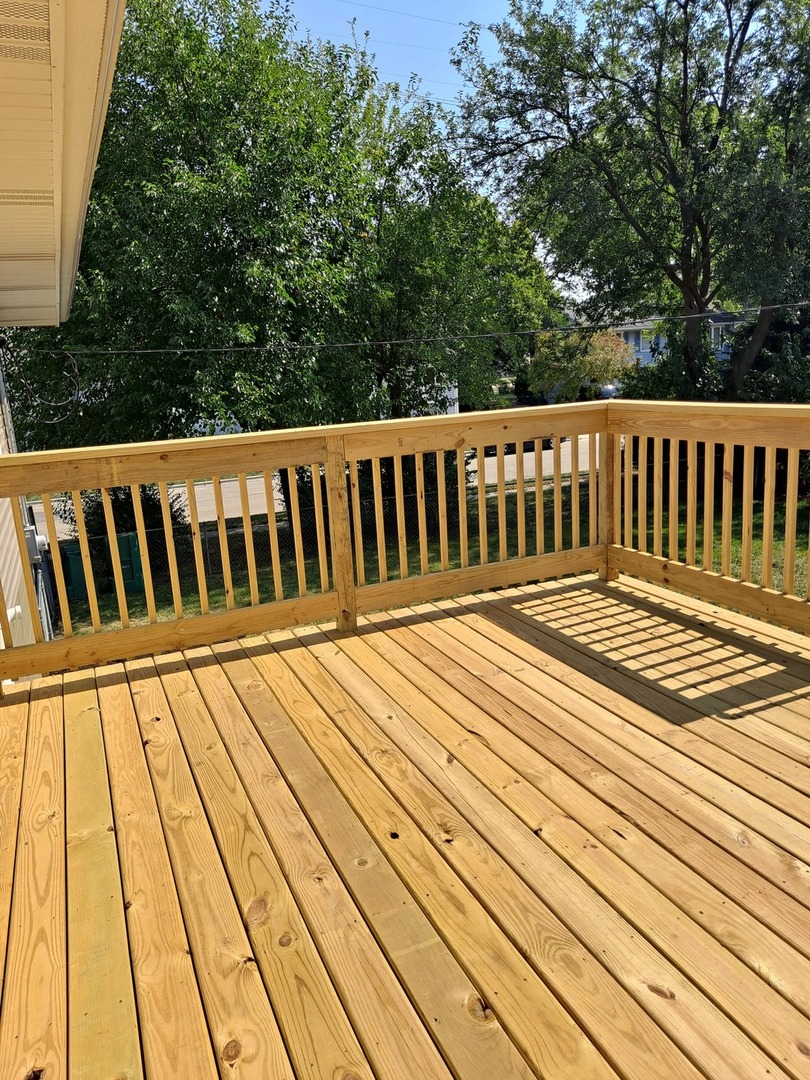 601 West Romeo Road Romeoville, IL 60446 - Photo 22 of 29 a view of a wooden deck