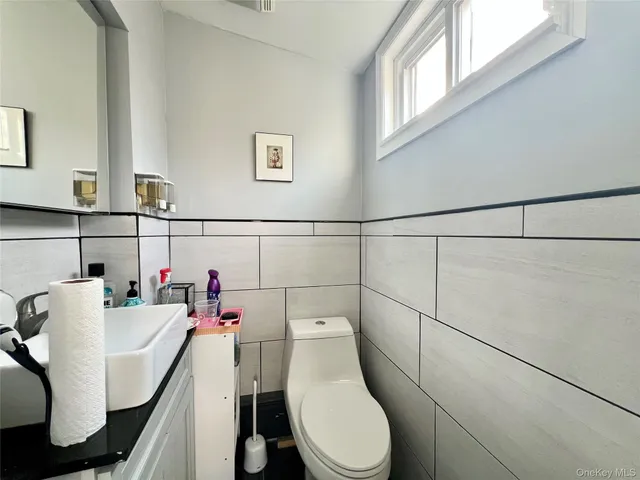 a bathroom with a toilet and a sink