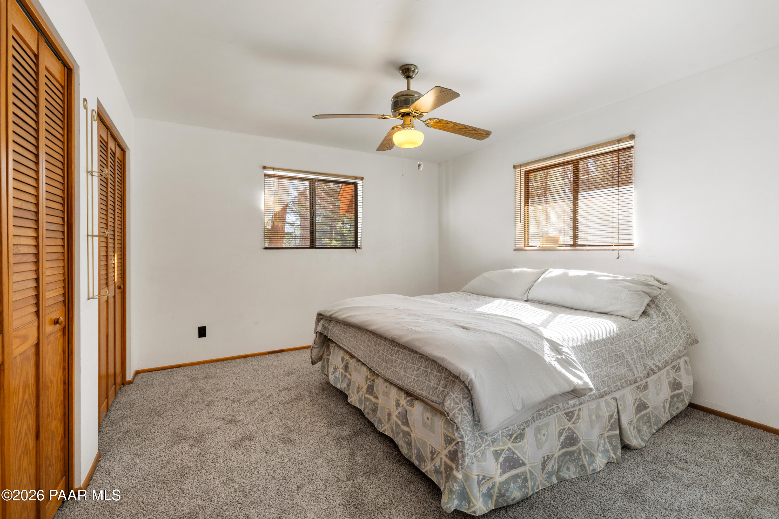 8520 South Hoot Owl Ridge Drive Prescott, AZ 86303 - Photo 12 of 25 a bedroom with a bed and a window