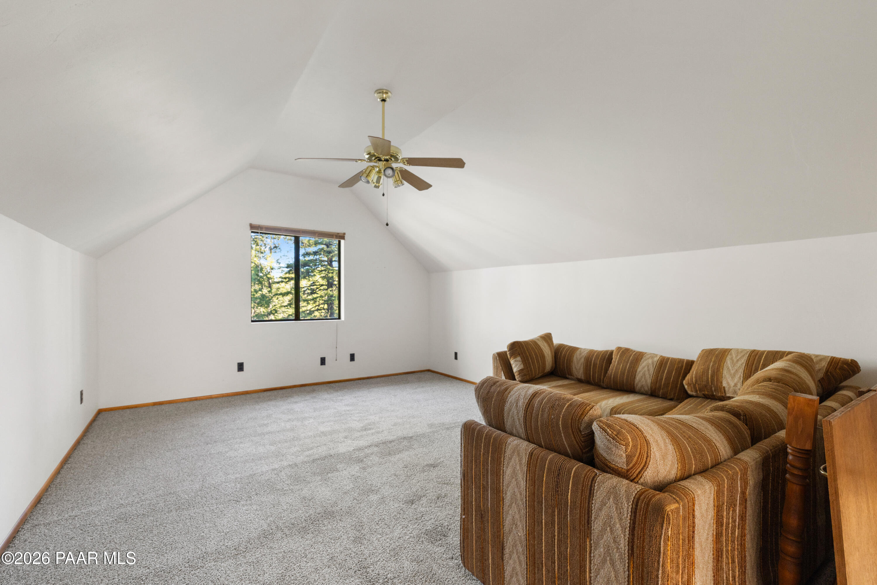 8520 South Hoot Owl Ridge Drive Prescott, AZ 86303 - Photo 14 of 25 a living room with furniture and a ceiling fan