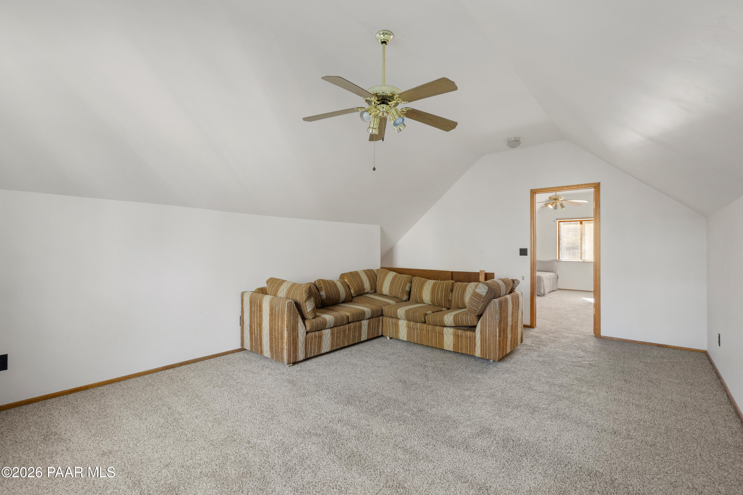 8520 South Hoot Owl Ridge Drive Prescott, AZ 86303 - Photo 15 of 25 a living room with furniture and a ceiling fan
