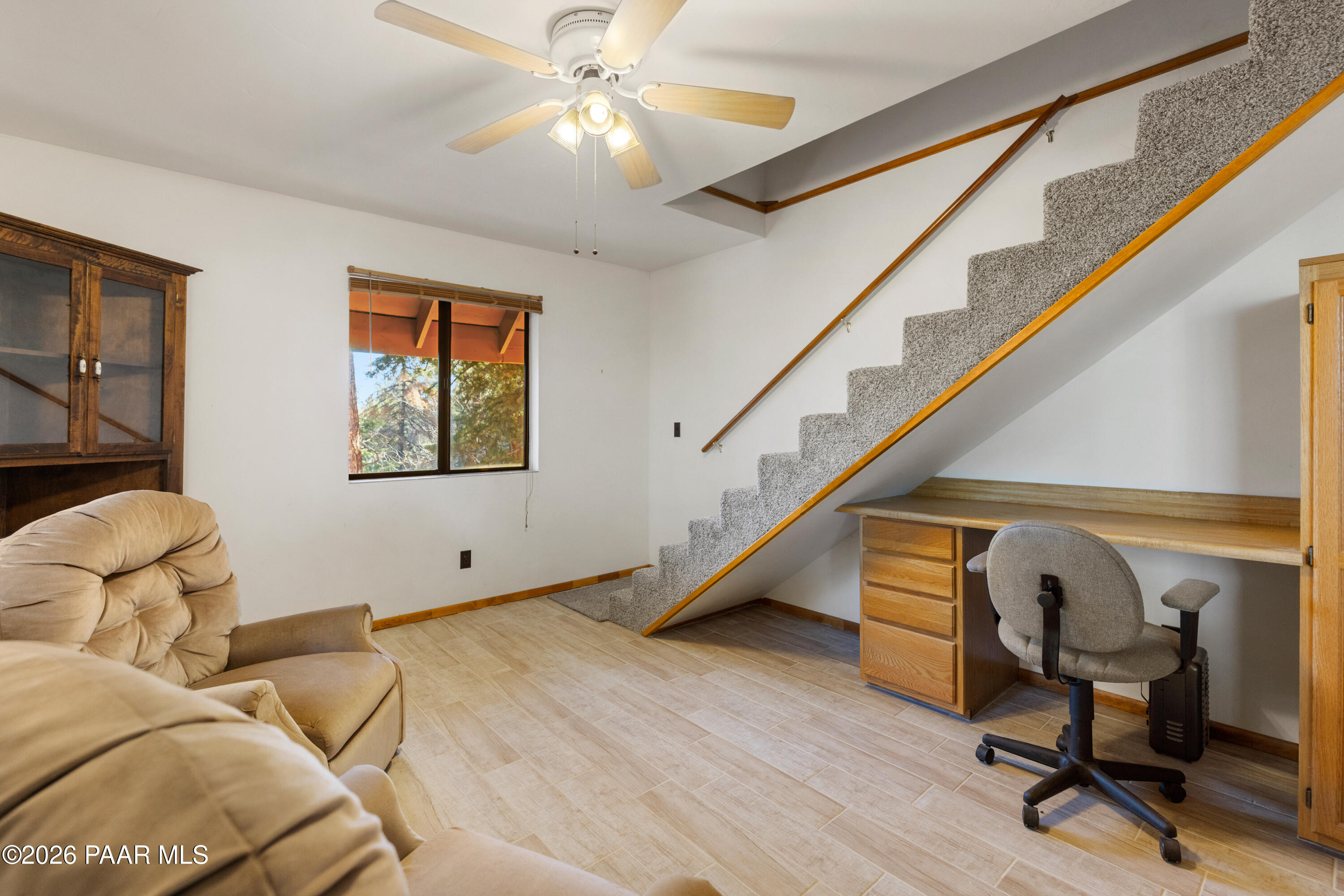 8520 South Hoot Owl Ridge Drive Prescott, AZ 86303 - Photo 10 of 25 a bedroom with furniture and a window