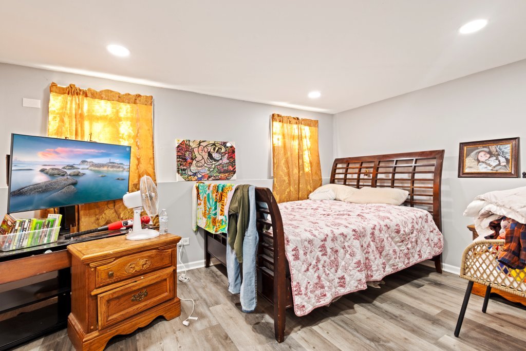 14564 Spaulding Avenue Harvey, IL 60426 - Photo 11 of 20 a bedroom with a bed and wooden floor