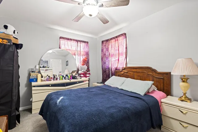 a bedroom with a bed and window