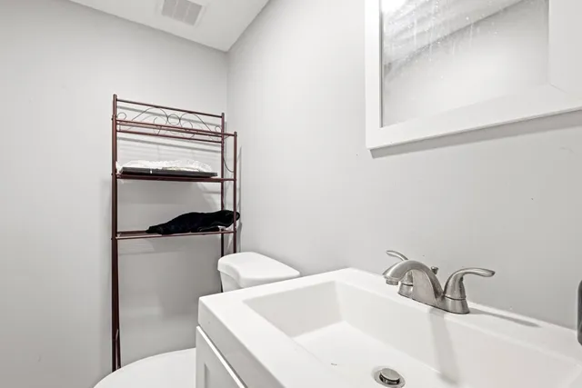 a bathroom with a sink and toilet