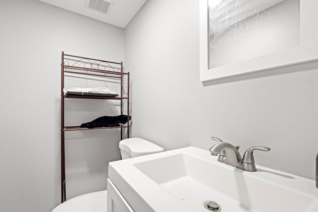 14564 Spaulding Avenue Harvey, IL 60426 - Photo 20 of 20 a bathroom with a sink and toilet