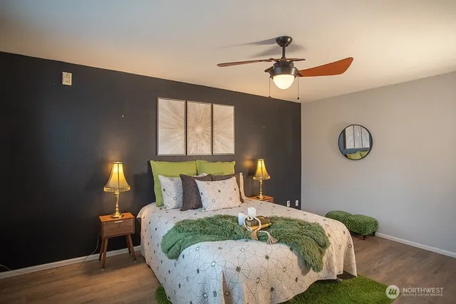 a bedroom with a bed and a window