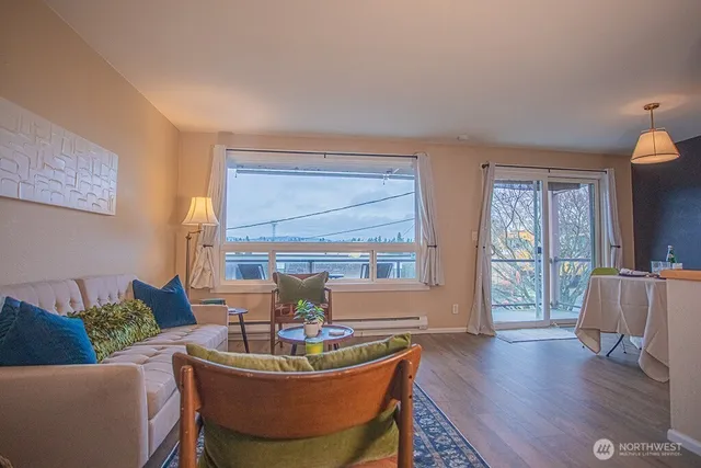 a living room with furniture and a large window