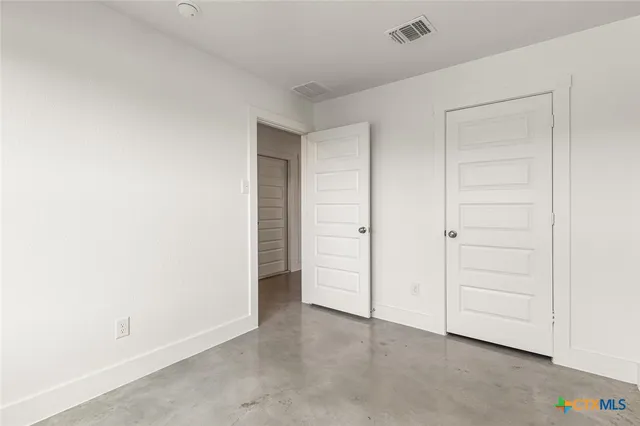 an empty room with closet