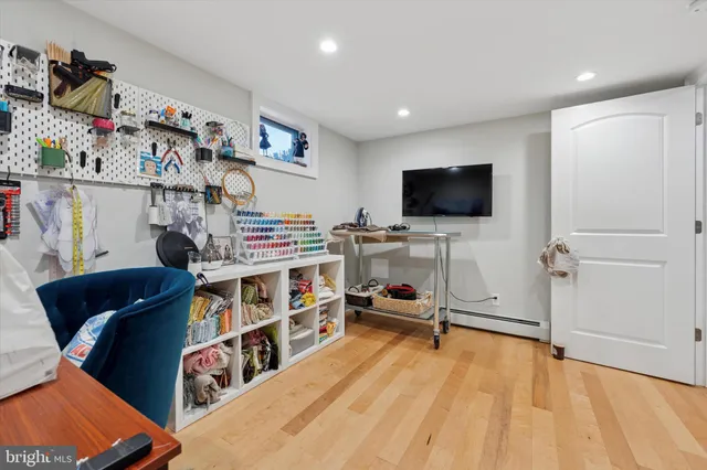 a workspace with furniture and a flat screen tv