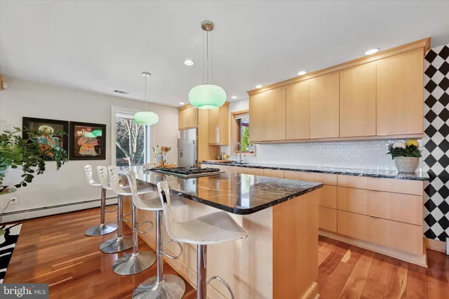a kitchen with a sink cabinets and window