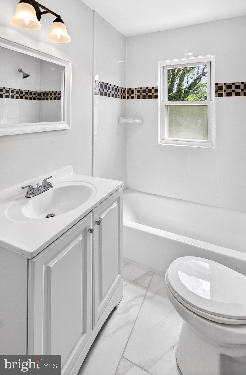 9081 Dumhart Road Laurel, MD 20723 - Photo 31 of 45 Bright and modern bathroom retreat.