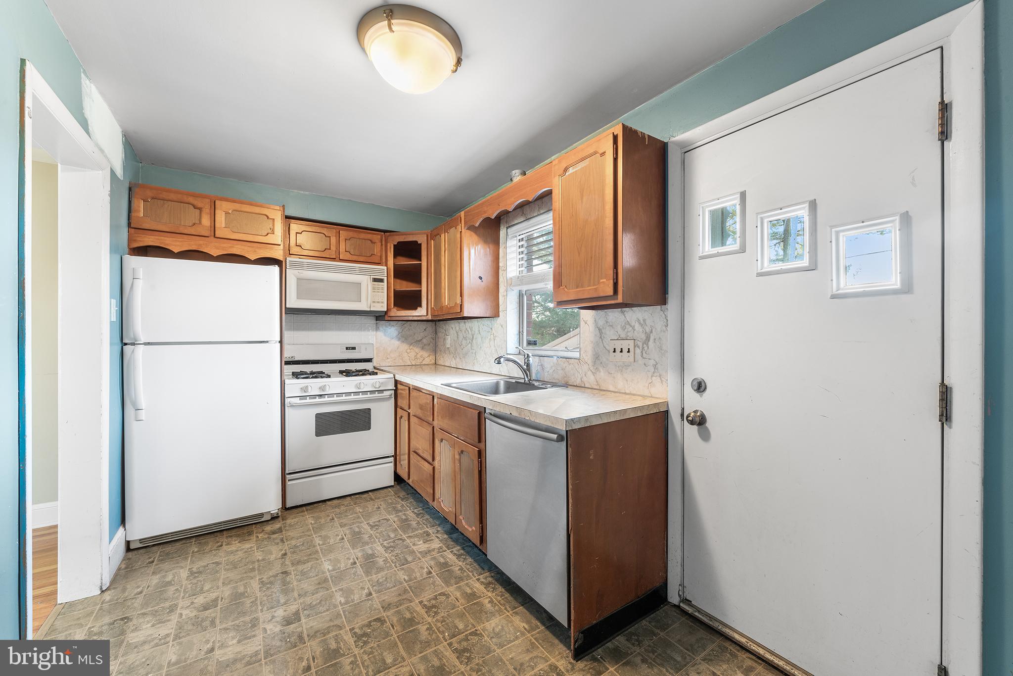 104 Brentwood Road Havertown, PA 19083 - Photo 13 of 28 a kitchen with a refrigerator sink and stove