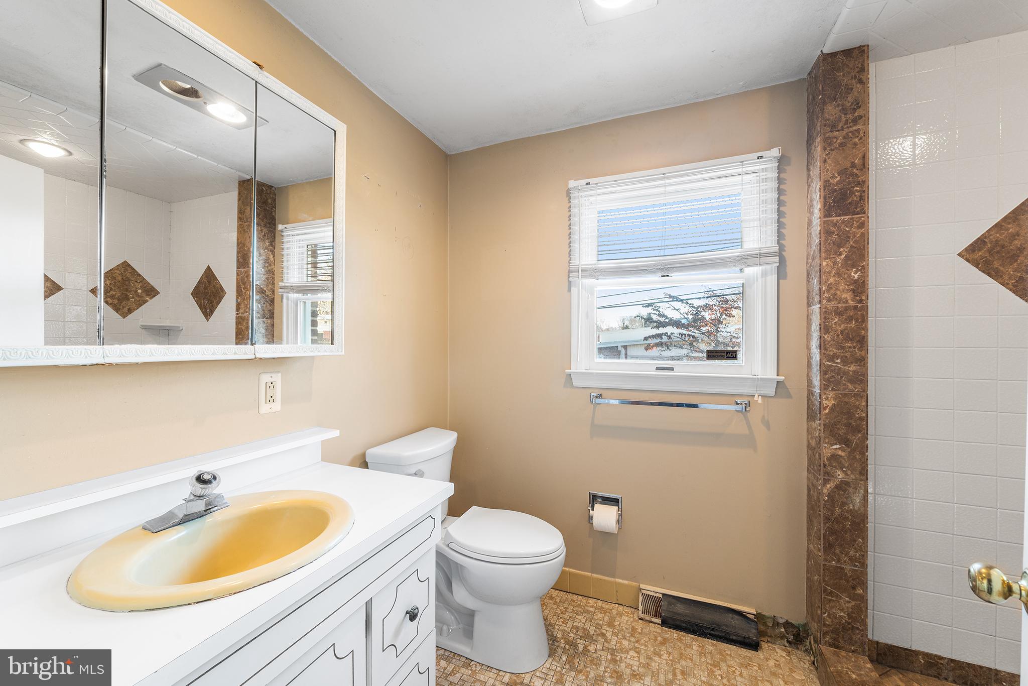 104 Brentwood Road Havertown, PA 19083 - Photo 14 of 28 a bathroom with a sink and a mirror