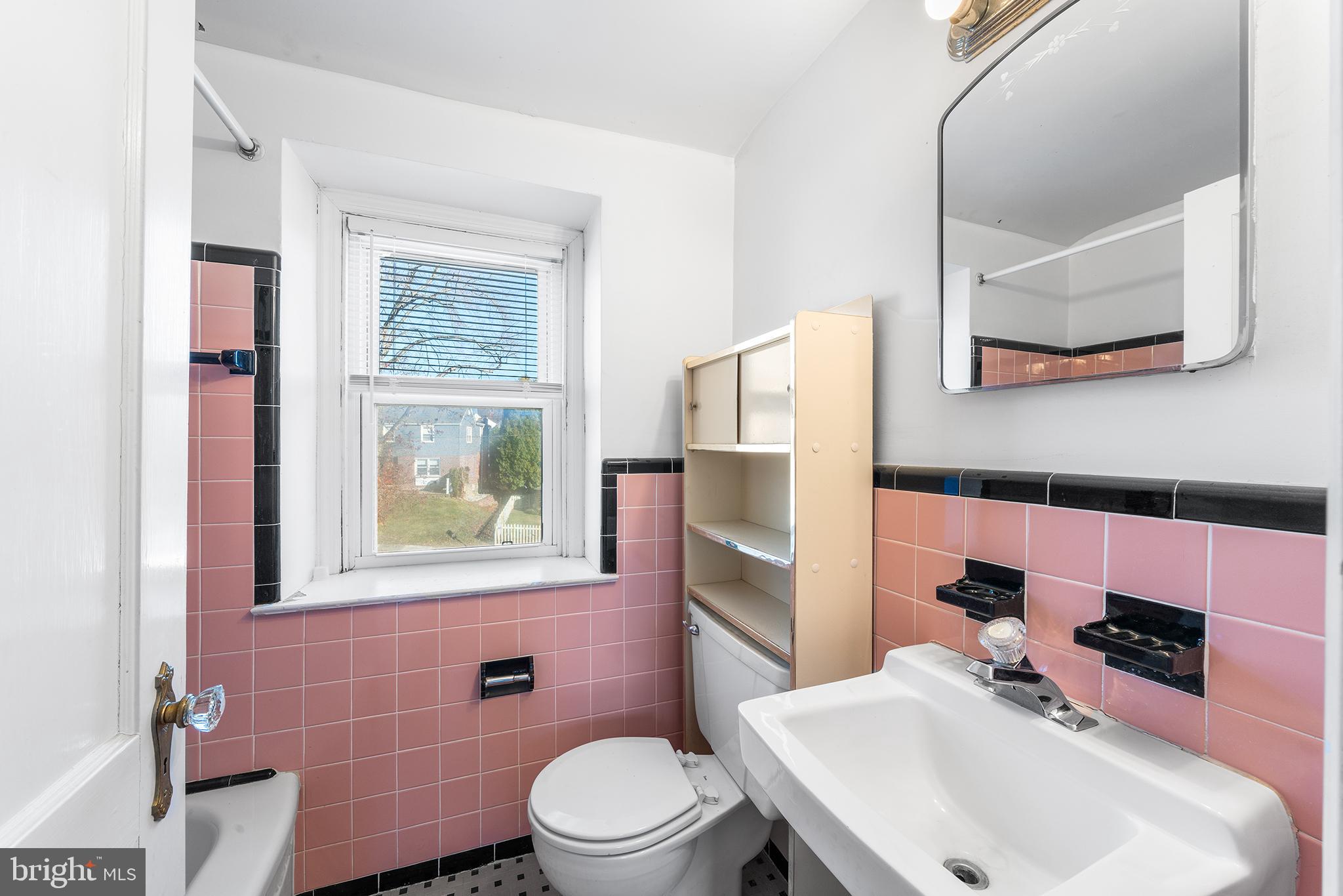 104 Brentwood Road Havertown, PA 19083 - Photo 20 of 28 a bathroom with a sink toilet and mirror