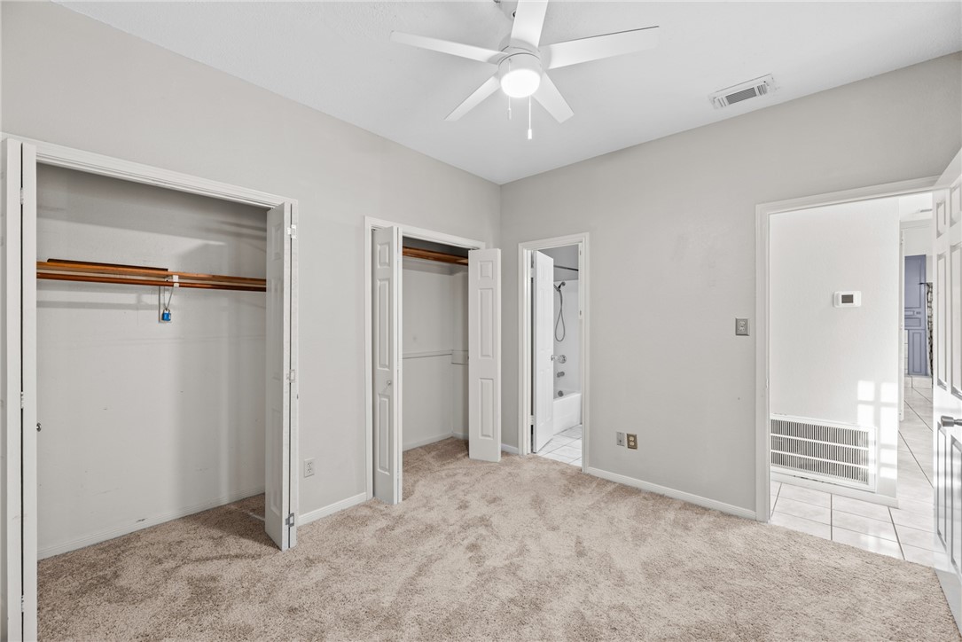 3025 Quail Springs Road, Unit B7 Corpus Christi, TX 78414 - Photo 11 of 23 a view of empty room with window and ceiling fan